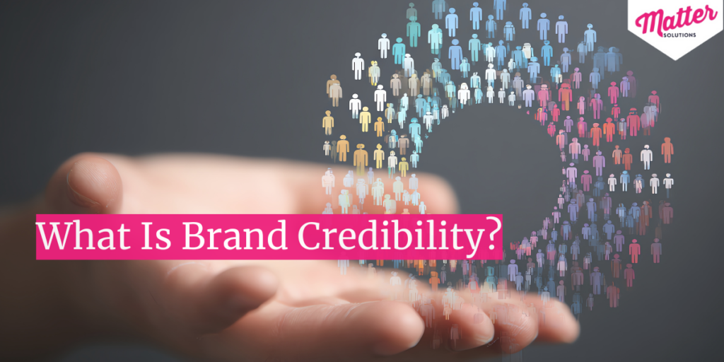 Graphic asking ‘What Is Brand Credibility?’ with crowd icon above an open hand.